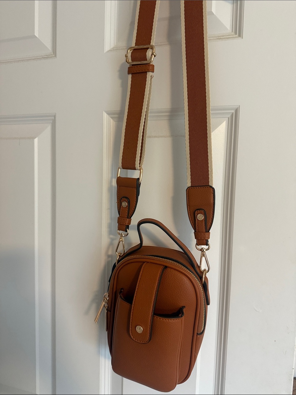 Compact Tan Crossbody Bag with Striped Adjustable Strap